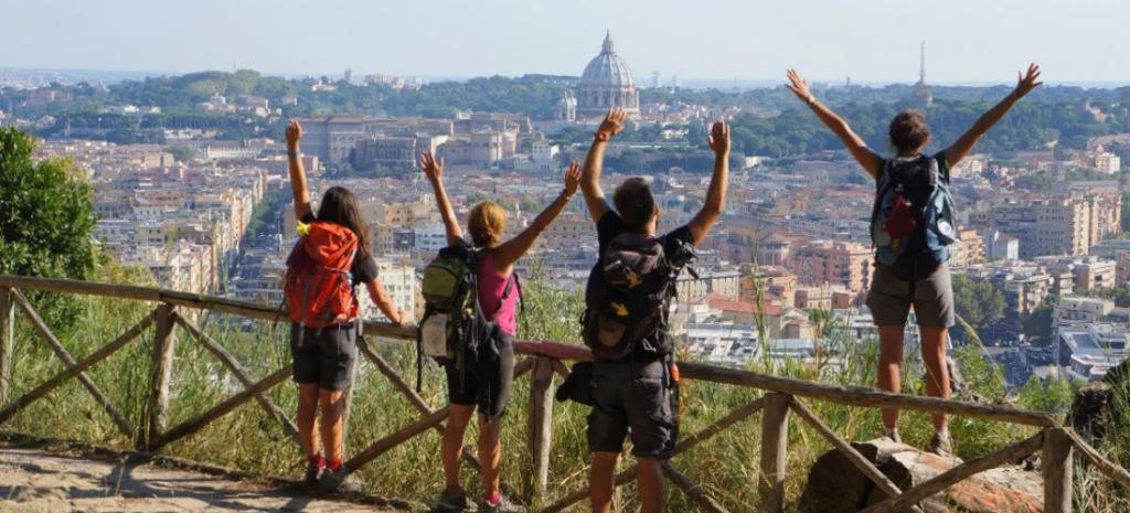 Four pilgrims arriving in Roma along the Via Francigena