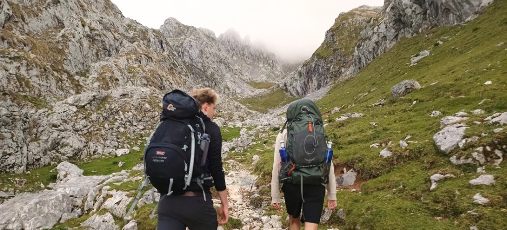 Two hikers walking the Anillo Vindio, in Picos de Europa