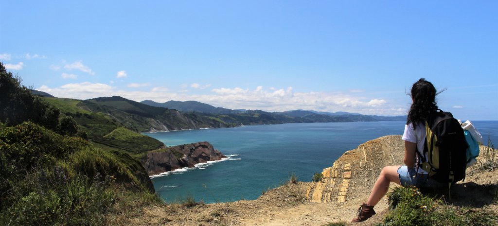 Hiker staring at the sea in Zumaia